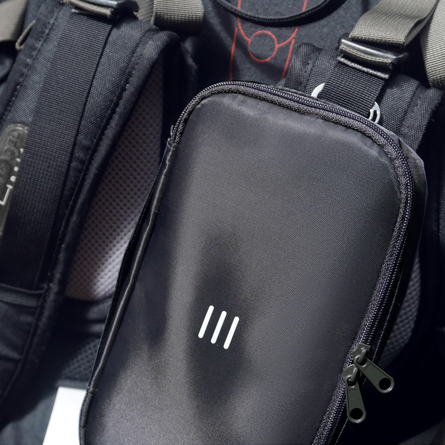 close up charcoal 190+ organizer attached to a backpack