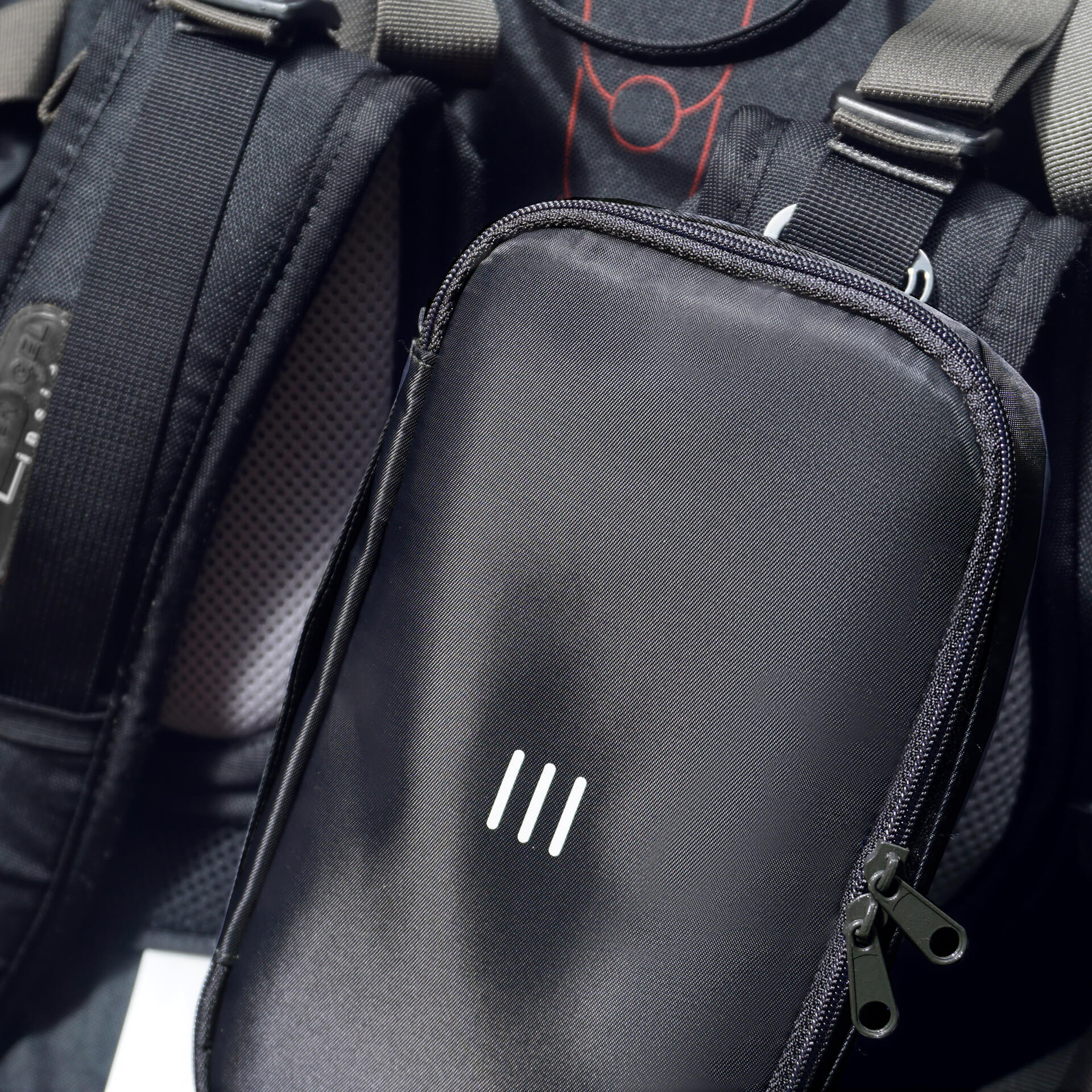 close up charcoal 190+ organizer attached to a backpack