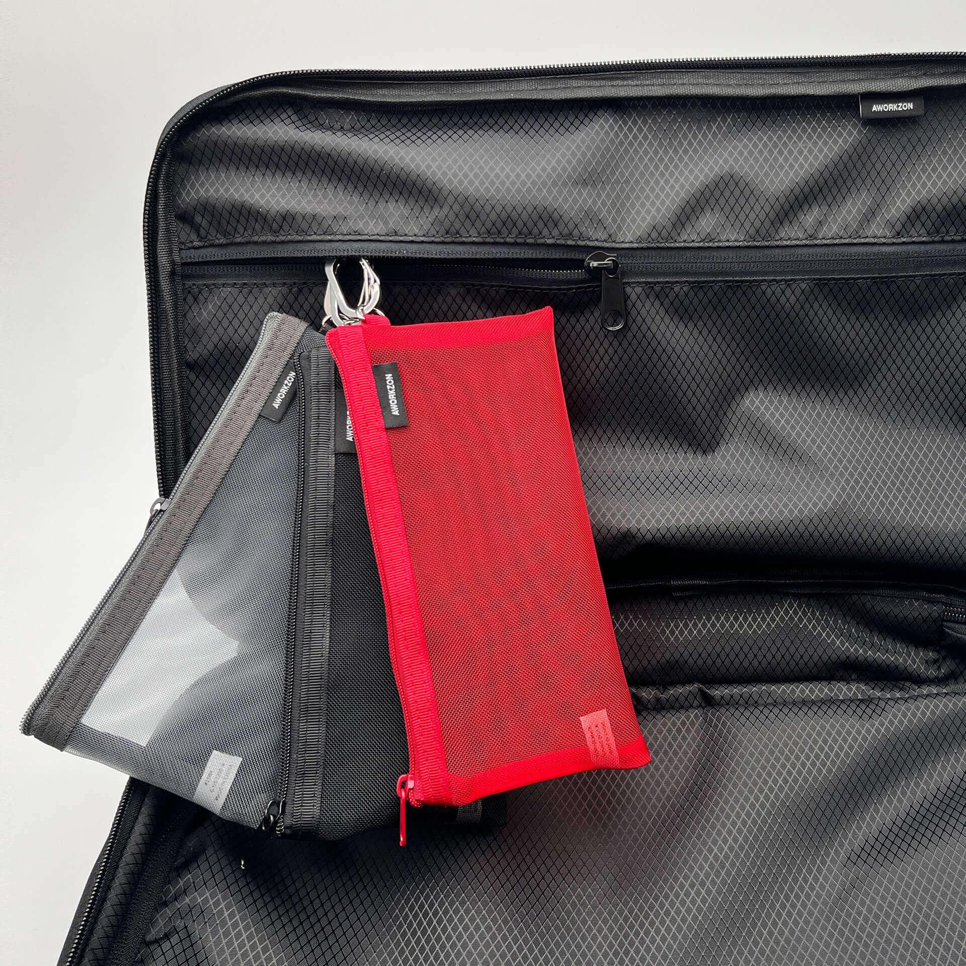 The internal cord loop of the FLEX holding three storage mesh pouches