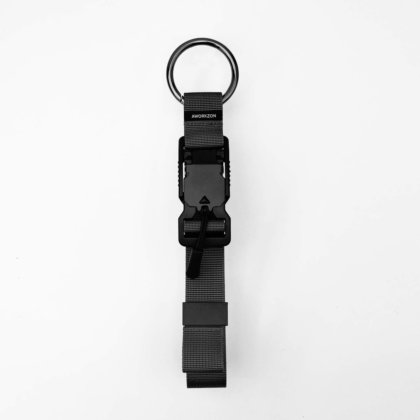 A gray quick-release access strap with a black magnetic buckle and a metal ring.
